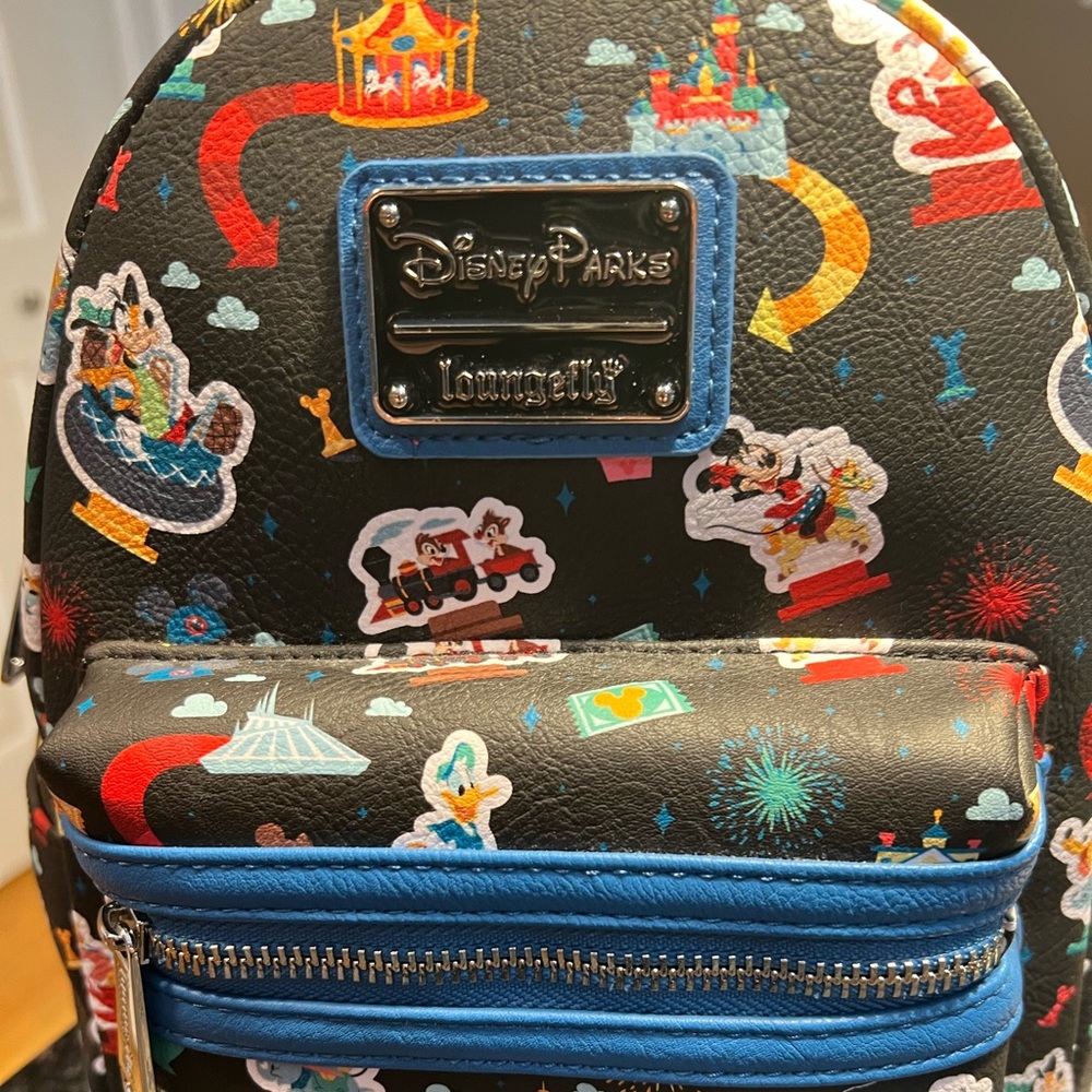 Loungefly Disney Parks Disneyland Ride all over Icon Mini Backpack NWT